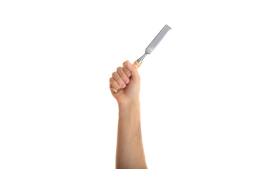 Hand holding a chisel on white background