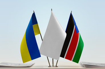 Flags of Ukraine and South Sudan with a white flag in the middle