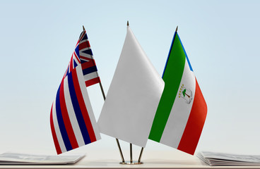 Flags of Hawaii and Equatorial Guinea with a white flag in the middle