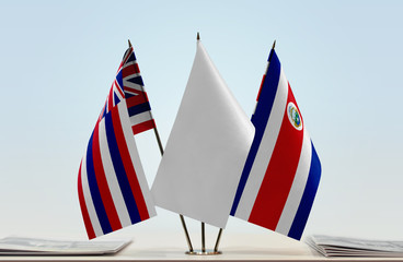 Flags of Hawaii and Costa Rica with a white flag in the middle
