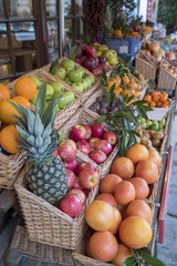 The High Street Broadway Village Worcesteshire English Cotswolds England UK. Fruit and vegetables are shown outside a grocery / greengrocery store.