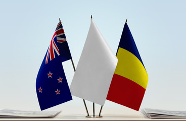 Flags of New Zealand and Chad with a white flag in the middle
