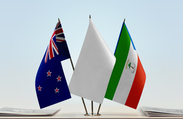 Flags of New Zealand and Equatorial Guinea with a white flag in the middle