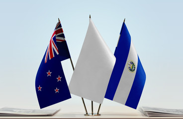 Flags of New Zealand and El Salvador with a white flag in the middle