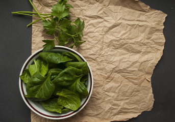 Brest spinach and parsley leaves on rustic background with space for your text. Healthy food...