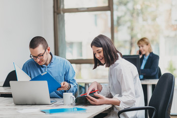 Colleagues working in office