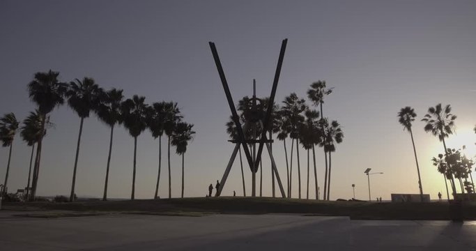 Venice Beach - Tracking Towards Main Courtyard Sculpture During Golden Hour