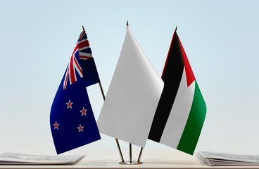 Flags of New Zealand and Palestine with a white flag in the middle