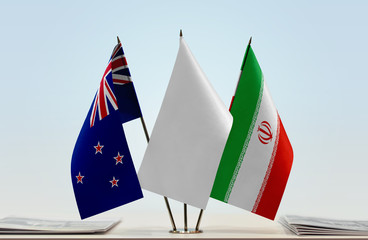 Flags of New Zealand and Iran with a white flag in the middle