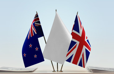 Flags of New Zealand and United Kingdom with a white flag in the middle