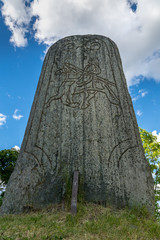 Closeup of a large rune stone from a low angle perspective