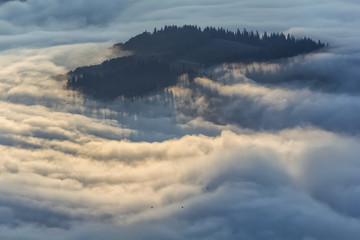 Beautiful mountain landscape of a foggy morning, Ceahlau massif, Eastern Carpathians, Moldova, Romania