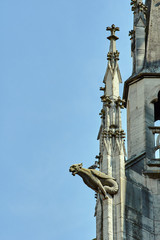 gargoyle and Turret Gothic facade of the church in Troyes, France .