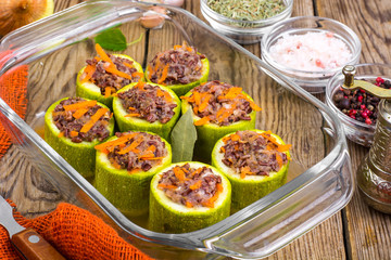 Vegetarian dish. Raw zucchini stuffed with red rice with vegetables