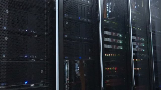 Web network, internet telecommunication technology, big data storage, cloud computing computer service business concept: server room interior in datacenter in blue light. 