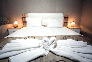 Fototapeta na wymiar Warm colored light in bedroom at hotel