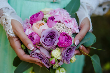 Colorful wedding bouquet with pink and magenta roses