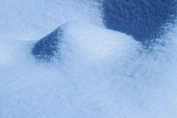 Fototapeta na wymiar Snow crystal and snowflakes background is a blue and white world shining under the sun.