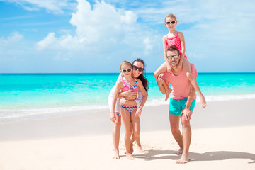 Happy beautiful family on a tropical beach vacation