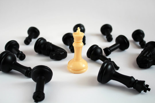 Chess figure, business concept strategy, leadership, team and success. Leadership concept, white king of chess among black pawns. leadership, confidence and imagination concept.