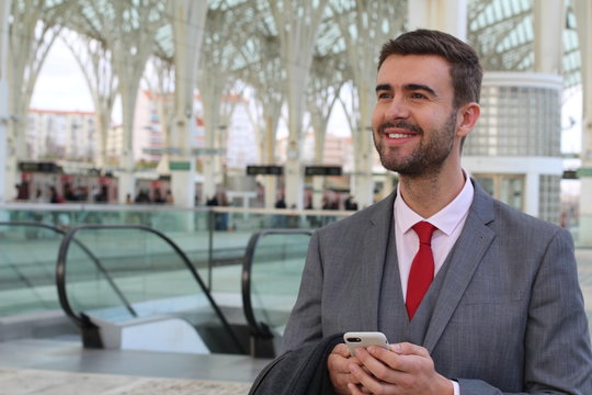 Joyful businessman smiling at terminal 