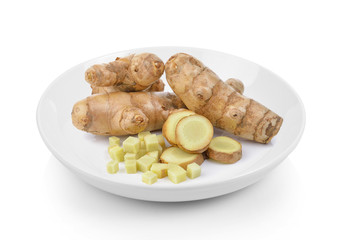 fresh turmeric in plate on white background