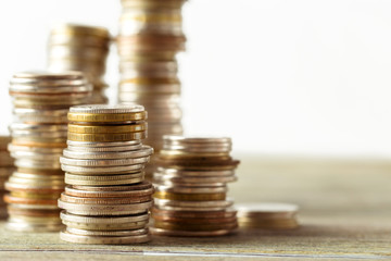 coins stack on wooden table