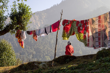 Rear view of woman and laundry line, Annapurna Circuit, en route to Ghorepani, Nepal