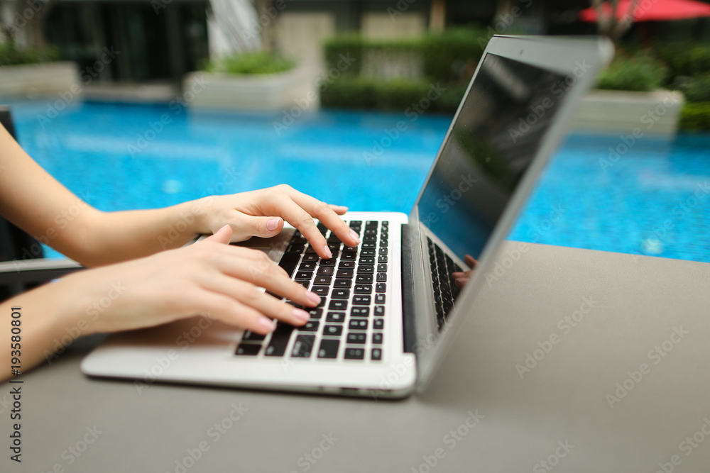 Canvas Prints fingers typing on the computer keyboard. close up portrait of woman hands pressing buttons on laptop