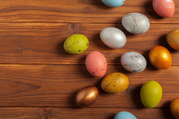 Happy easter! Easter eggs on wooden background