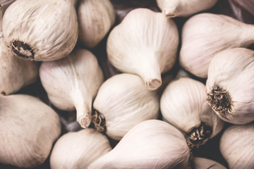 Garlic. Garlic Cloves and Garlic Bulb in vintage wooden bowl.