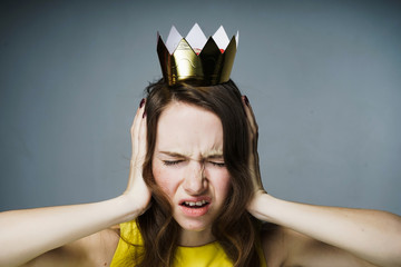 the dissatisfied young girl covered her ears with her hands, she did not want to hear anything, she...