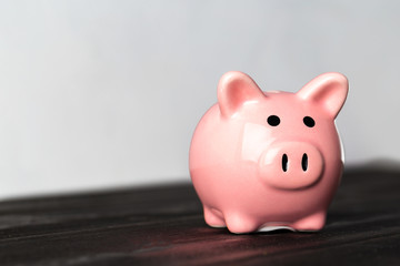 piggy bank on the old wooden background