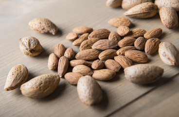 Almonds on wooden table