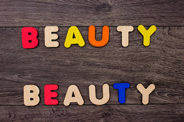 Naklejka premium Beauty word from wooden letters