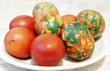Colorful Easter Eggs On White Plate Placed By Heap