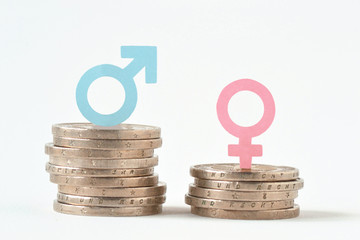 Male and female symbols on piles of coins - Gender pay equality concept - obrazy, fototapety, plakaty