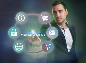 Business, Technology, Internet and network concept. Young businessman working on a virtual screen of the future and sees the inscription: HR management