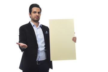 Arab businessman holding white board. advertisement concept. isolated