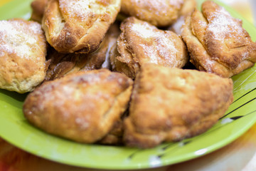 Biscuit cookies with sugar, cooked, lies in a plate on the table