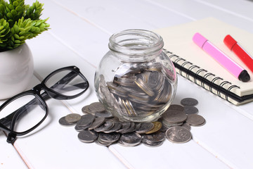 saving concept - coin in glass jar