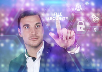 Business, Technology, Internet and network concept. Young businessman working on a virtual screen of the future and sees the inscription: File security