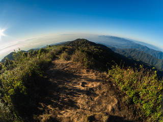 The sun rises on the top of the hill