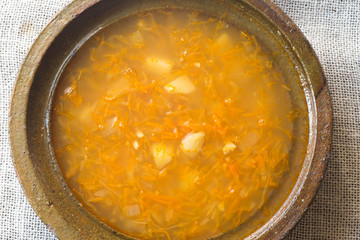 cabbage soup in clay bowl