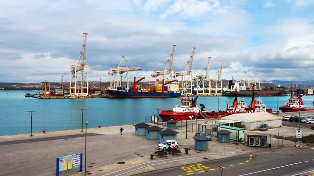 Koper, Slovenia. Aerial view of port of Koper, Slovenia. Cloudy sky over the port during the sunny day. Time-lapse, zoom in