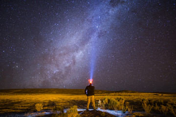 Man looking up at the Milky Way Galaxy in Potosi Department of Bolivia's Altiplano region