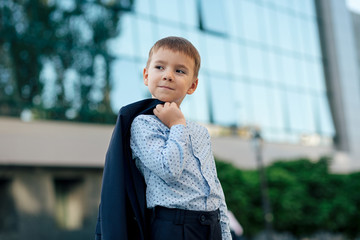 School boy posing in formal wear, elegant clothes