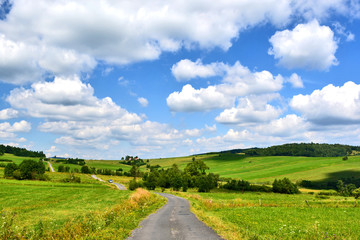 Fototapeta na wymiar Rural road and countryside of Beskid Niski, Poland