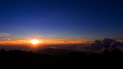 Fototapeta na wymiar Sunrise over the mountains at Doi Inthanon Chiangmai Thailand