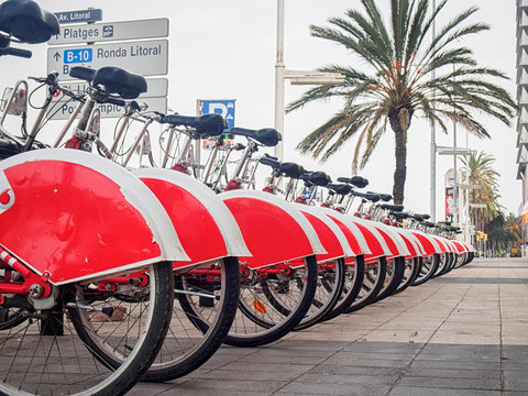 Group of red rental bicycles at the Barcelona street